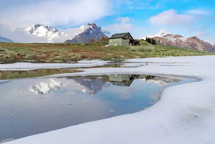 Framed Print : Mountain hut on shore of frozen pond during thaw, Scermendone Alp, Rhaetian Alps, Valtellina, Lombardy, Italy, Europe Framed Print : Mountain hut on shore of frozen pond during thaw, Scermendone Alp, Rhaetian Alps, Valtellina, Lombardy, Italy, Europe
