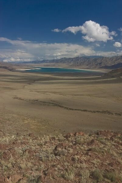 Mountain lake in vast landscape on the road between Bishkek and Song Kol