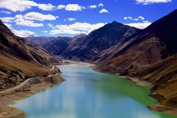 Mountain range and artificial lake (reservoir) near the Karo-La Pass, beside the Friendship Highway, Tibet, China, Asia