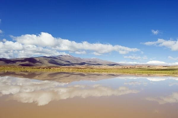 Mountain scenery reflecting in a lake, Altiplano, Bolivia, South America