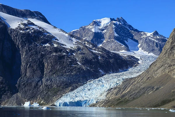 Mountains and tidewater glacier, rugged South Skjoldungen Fjord and Island, glorious weather