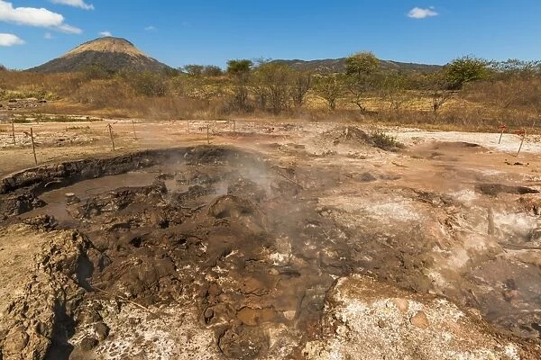 Mud pots, fumaroles and dormant Volcan Santa Clara at the San Jacinto volcanic thermal area north of Leon, Leon, Nicaragua, Central America