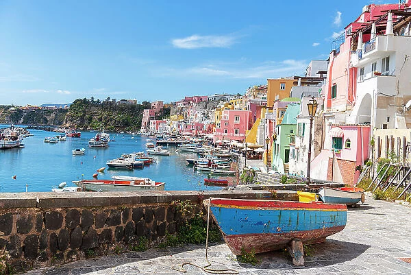 Multi-coloured houses and boats at Marina Corricella, Procida island, Naples Bay, Naples province, Phlegraean islands, Campania region, Italy, Europe