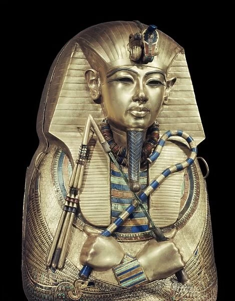 Mummiform coffin of gold with inlaid semi-precious stones and glass-paste