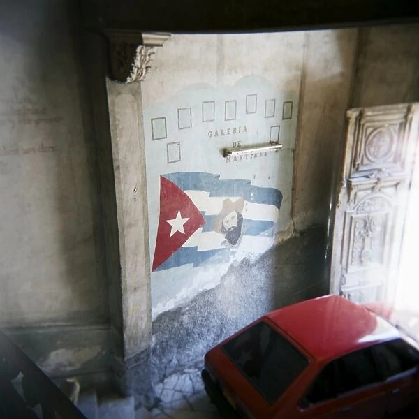 Mural of Camilo Cienfuegos on the wall of an apartment building, Havana