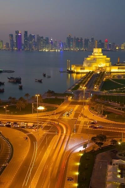Museum of Islamic Art and West Bay Central Financial District from East Bay District at dusk, Doha, Qatar, Middle East