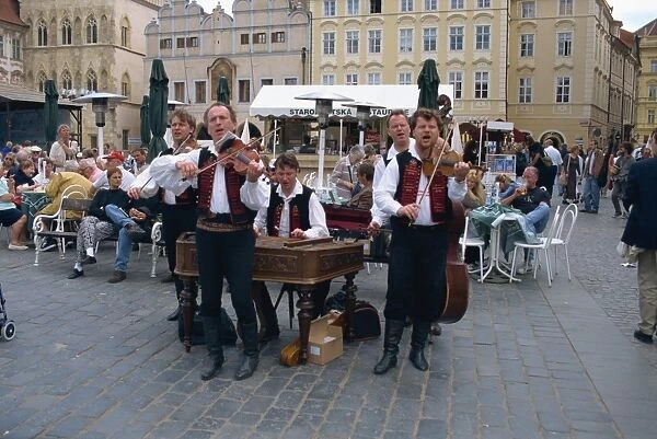 Musicians playing in city square, Prague, Czech Republic, Europe