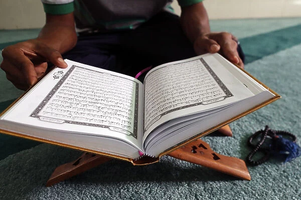 Muslim reading the Quran in Mosque, Ho Chi Minh City, Vietnam, Indochina, Southeast Asia