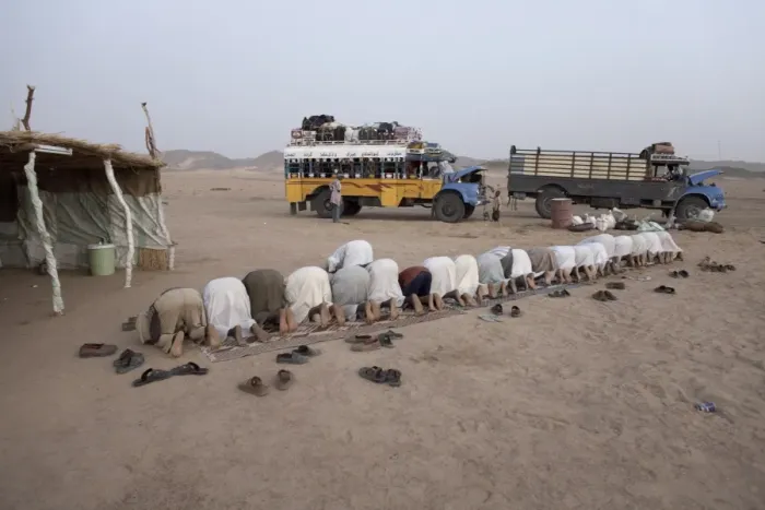 Framed Print : Muslims stop in the Nubian Desert for evening prayers Framed Print : Muslims stop in the Nubian Desert for evening prayers