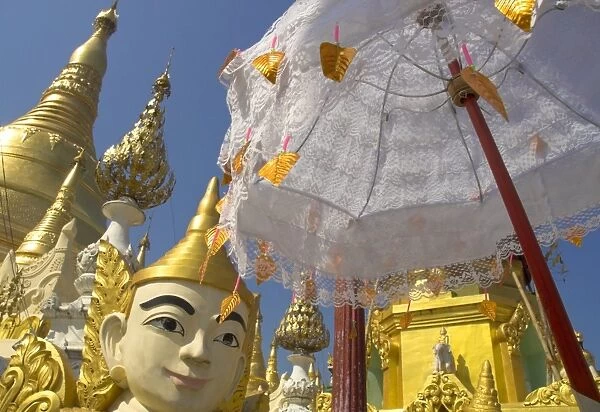 Mystical figure, white umbrella and golden stupas, Shwedagon Paya, Yangon (Rangoon)
