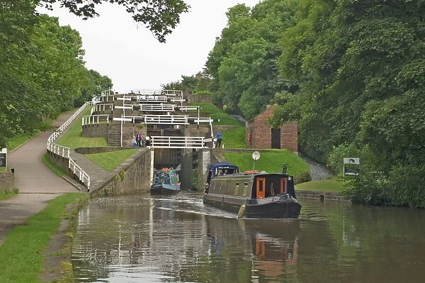 Narrow boats on the Liverpool Leeds canal, negotiating the five lock ladder at Bingley