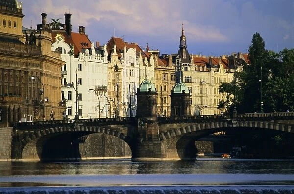 The National Theatre and houses along the Vltava River, Prague, Czech Republic, Europe