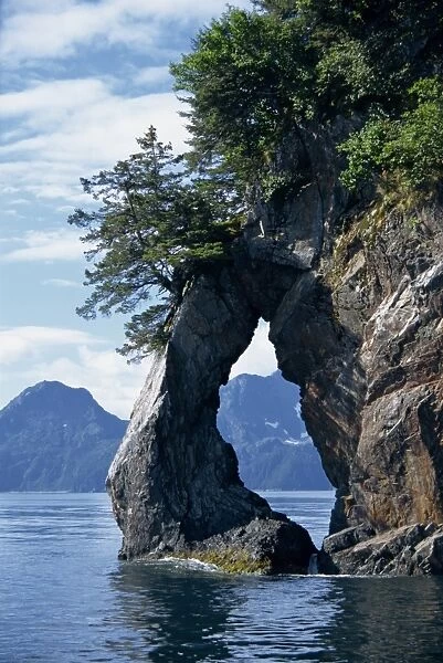 Natural arch on edge of Threehole Bay