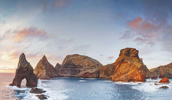 Natural arch, stone rocks and cliffs at dawn from Ponta do Rosto viewpoint