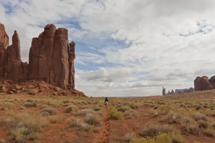 Framed Print : Navajo person rides a horse between rock formations, Monument Valley Navajo Tribal Park, Utah Arizona, United States of America Framed Print : Navajo person rides a horse between rock formations, Monument Valley Navajo Tribal Park, Utah Arizona, United States of America