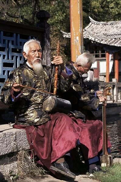 The Naxi orchestra pracisting by the Black Dragon Pool, Lijiang, Yunnan province