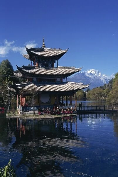 The Naxi orchestra practises beneath a pagoda by the Black Dragon Pool in Lijiang