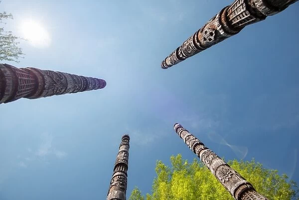 Four Naxi poles with wood carvings, Lijiang, Yunnan, China, Asia