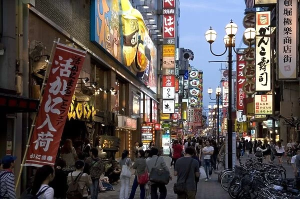 Neon signs bring Dotonbori entertainment district to life after sunset, Osaka, Japan