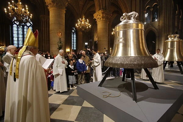 The new bronze bells are displayed in the nave during a ceremony of blessing by Paris