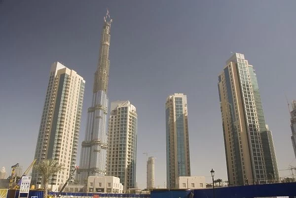 New high rise buildings inland from Jumeirah area, Burj Dubai, worlds tallest building under construction in background, Dubai Creek, Dubai, United Arab Emirates