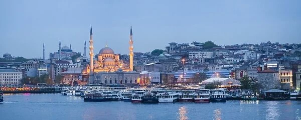 New Mosque (Yeni Cami) on the banks of the Golden Horn at night with Hagia Sophia