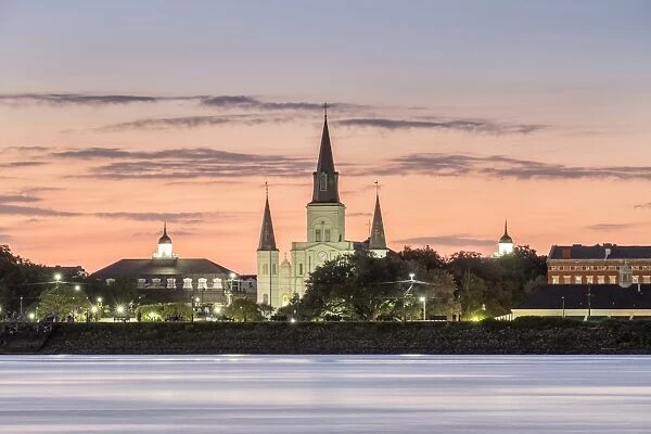 New Orleans skyline, view of Saint Louis Cathedral from across the Mississippi River at sunset