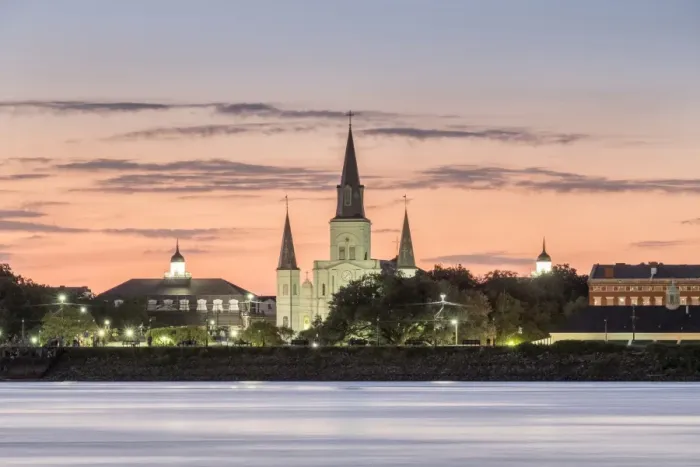 Framed Print : New Orleans skyline, view of Saint Louis Cathedral from across the Mississippi River at sunset Framed Print : New Orleans skyline, view of Saint Louis Cathedral from across the Mississippi River at sunset