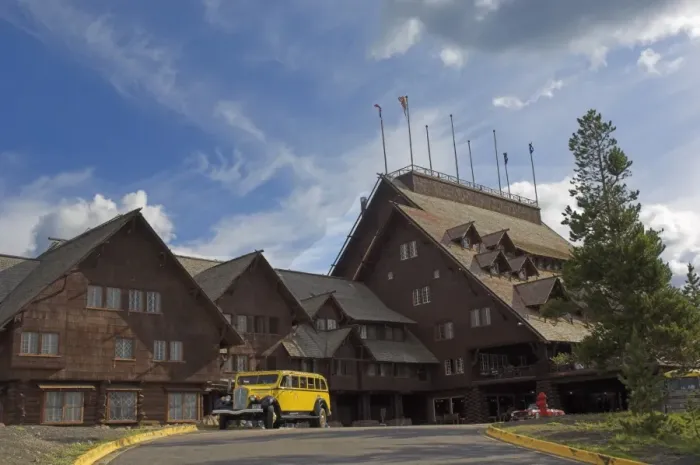 Framed Print : New restored yellow Yellowstone coach outside the historic Old Faithful Inn Framed Print : New restored yellow Yellowstone coach outside the historic Old Faithful Inn
