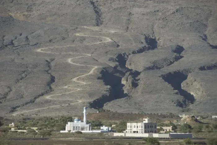 Framed Print : New village mosque, with road behind climbing onto Jabal Akhdar, Tanuf Framed Print : New village mosque, with road behind climbing onto Jabal Akhdar, Tanuf