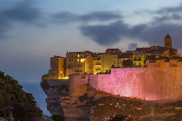 Night view of the Citadel and old town of Bonifacio perched on rugged cliffs, Bonifacio
