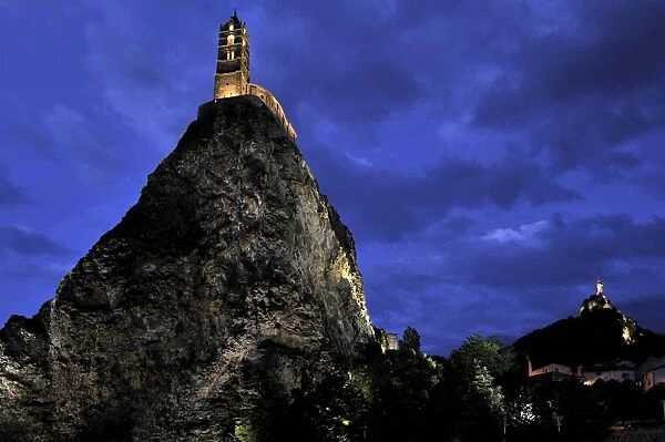 Night view of floodlit Saint Michel d Aiguilhe Chapel, situated on the top of volcanic rock