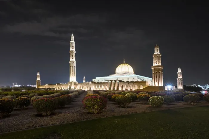 Framed Print : Night view of Sultan Qaboos Mosque illuminated and the oleander field in the foreground Framed Print : Night view of Sultan Qaboos Mosque illuminated and the oleander field in the foreground