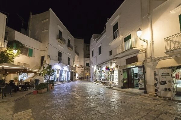 Night view of the typical alleys of the medieval old town, Ostuni, Province of Brindisi