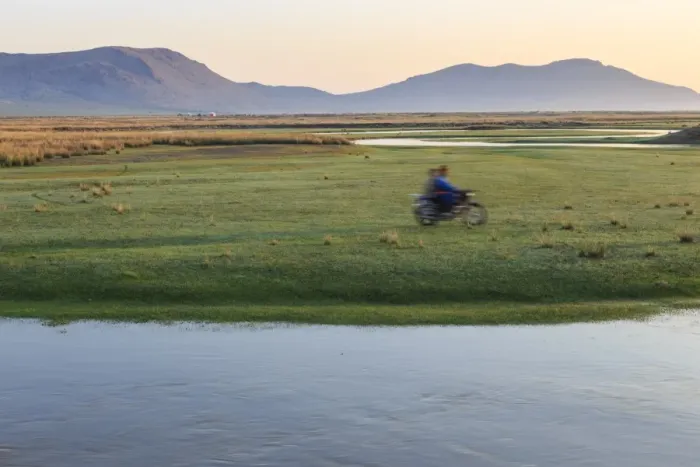 Framed Print : Nomads on motorcycle pass in a blur, river and distant gers, dawn, Nomad camp, Gurvanbulag Framed Print : Nomads on motorcycle pass in a blur, river and distant gers, dawn, Nomad camp, Gurvanbulag