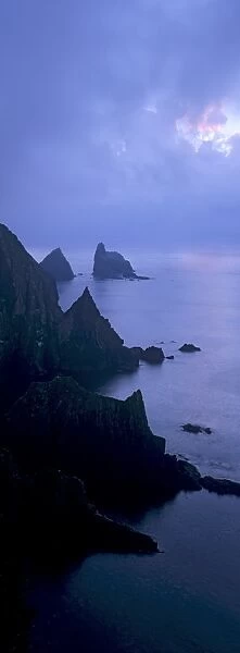 North cliffs and stack of Skroo in the mist