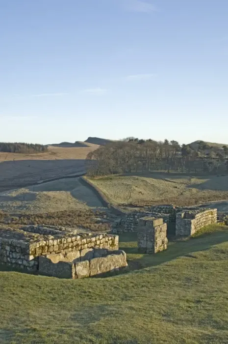 Framed Print : North gateway to Housesteads Roman Fort, stone water storage tank in foreground Framed Print : North gateway to Housesteads Roman Fort, stone water storage tank in foreground