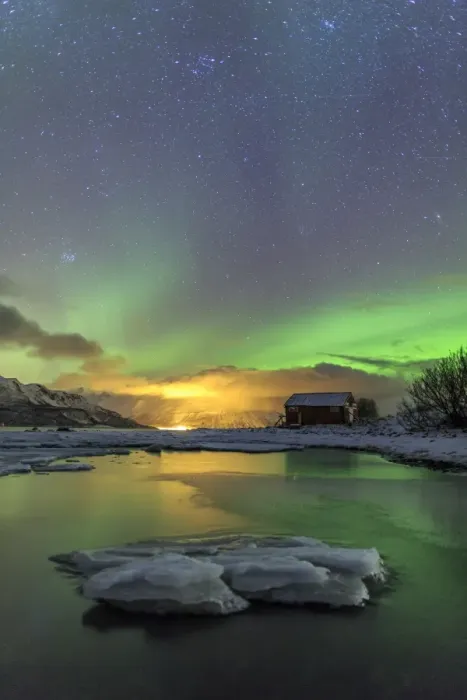 Framed Print : The Northern Lights illuminates the wooden cabin, Oteren, Storfjorden, Lyngen Alps