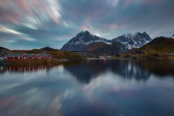 Norwegian fjord at blue hour with typical illuminated red cabins, Moskenesoya, Nordland, Lofoten, Norway, Scandinavia, Europe