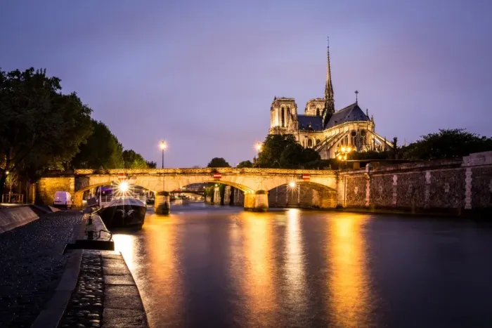 Framed Print : Notre Dame Cathedral and lights reflecting in the River Seine on a wet evening in Paris Framed Print : Notre Dame Cathedral and lights reflecting in the River Seine on a wet evening in Paris