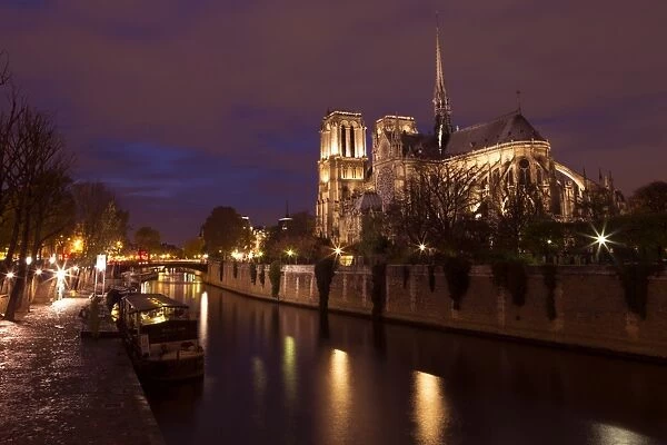 Notre Dame Cathedral at night with River Seine, Paris, France, Europe
