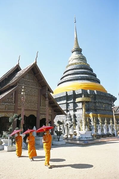Novice monks and Wat Phra That Lampang Luang
