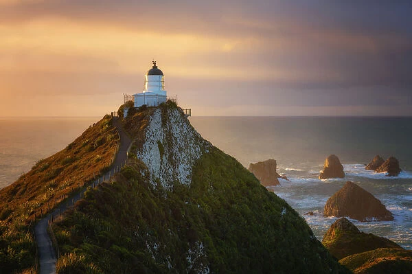 Nugget Point Lighthouse at sunrise, Nugget Point, Otago, South Island, New Zealand