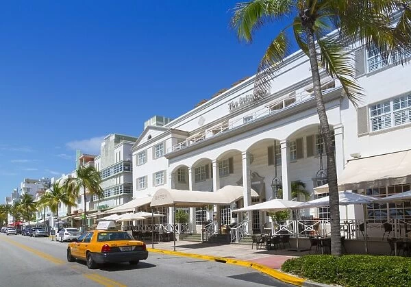 Ocean Drive and Art Deco architecture and yellow cab, Miami Beach, Miami, Florida