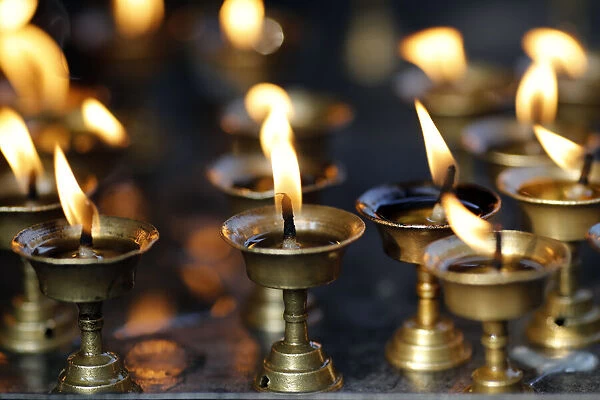 Oil (butter) lamps burning in Hindu temple, Kathmandu, Nepal, Asia