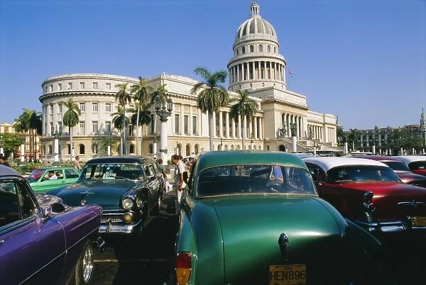 Old 1950s American cars outside El Capitolio Building, Havana, Cuba