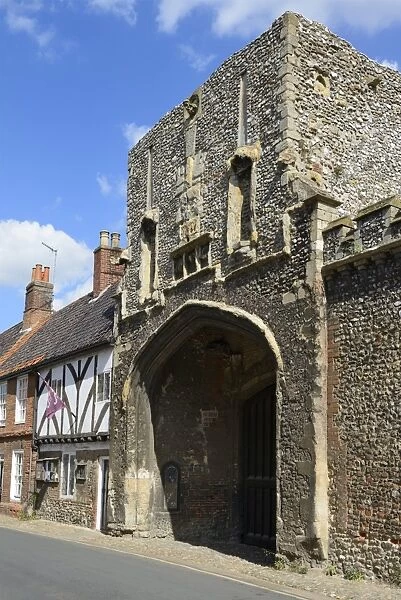 The old Abbey entrance and medieval timber framed houses, High Street, Little Walsingham, Norfolk, England, United Kingdom, Europe