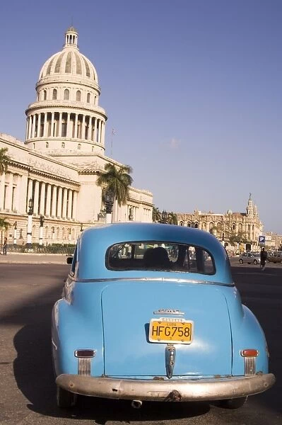An old American car in front of the Capitolio in central Havana, Cuba, West Indies