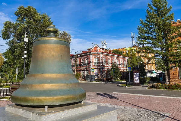 Old bell in front of Historic buildings, Minusinsk, Krasnoyarsk Krai, Russia, Eurasia