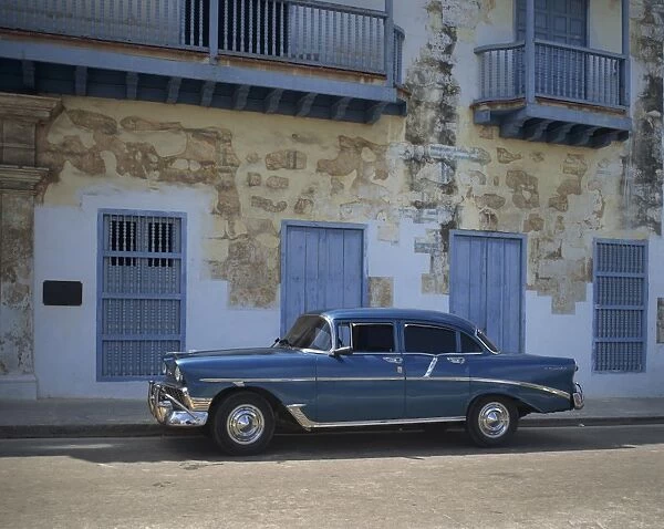 An old blue Chevrolet car parked in a street in Old Havana, Cuba, West Indies
